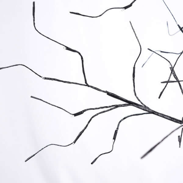 Close-up of Halloween ghost trees with lights branches, showcasing their adjustable twisted forms for spooky décor.